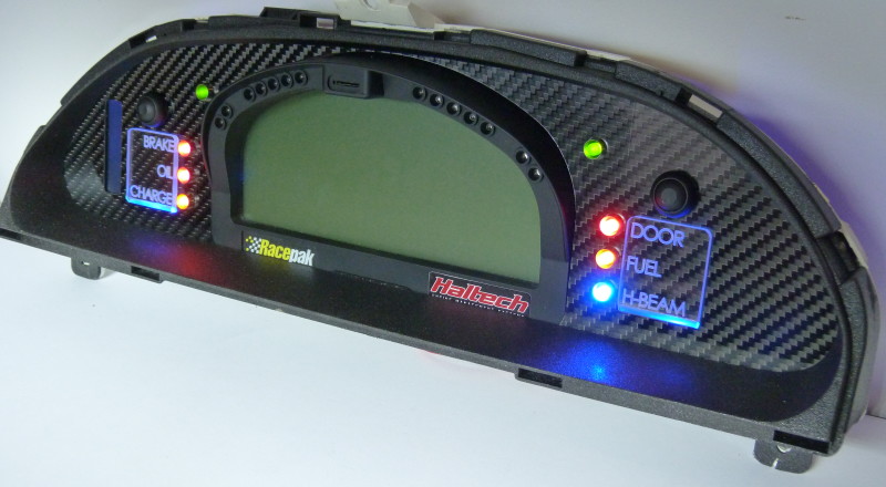 A Custom Cluster Built for A Nissan S13,180sx or 240sx to hold a Racepak IQ3 Display Dash and utilise the factory Odometer