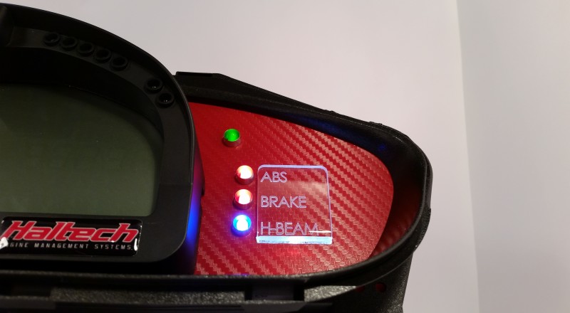 A Custom Nissan S14 Silvia 240sx Cluster built for a Racepak IQ3 Display Dash using Red Carbon Right Side