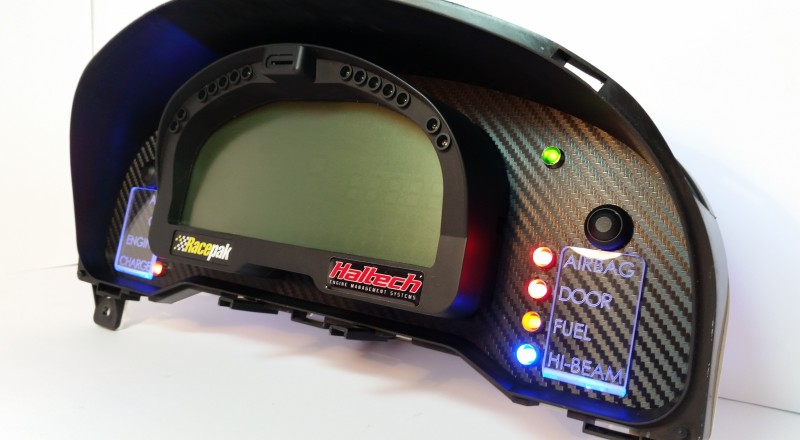 A Custom Cluster with a Racepak IQ3 Display built for a nissan S15 Sivia 200sx with Blue illumination Right