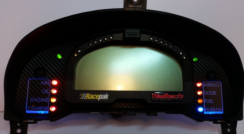 A Custom Cluster with a Racepak IQ3 Display built for a nissan S15 Sivia 200sx with Blue illumination Front