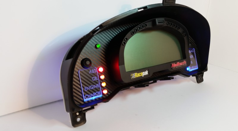 A Custom Cluster with a Racepak IQ3 Display built for a nissan S15 Sivia 200sx with Blue illumination Left