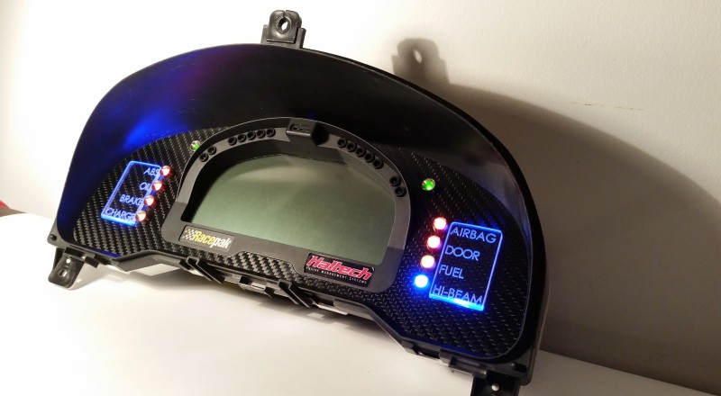A Custom Cluster with a Racepak IQ3 Display built for a Nissan S15 Sivia 200sx with Blue LED illumination Side 2