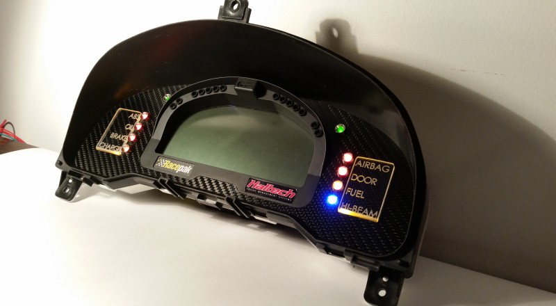 A Custom Cluster with a Racepak IQ3 Display built for a nissan S15 Sivia 200sx with Amber LED illumination Side 2