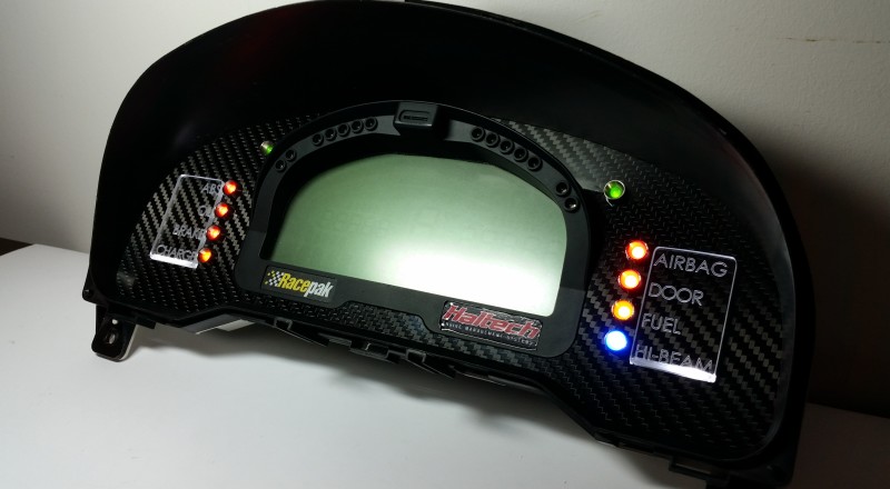 A Custom Cluster with a Racepak IQ3 Display built for a Nissan S15 Sivia 200sx with White LED illumination Side