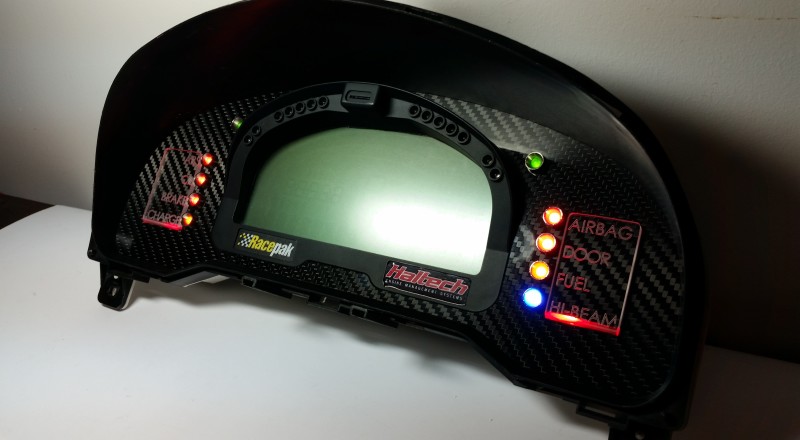 A Custom Cluster with a Racepak IQ3 Display built for a Nissan S15 Sivia 200sx with Red LED illumination Side