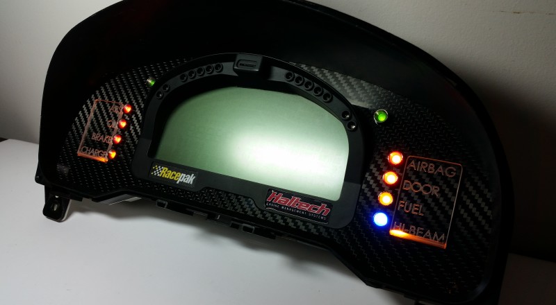 A Custom Cluster with a Racepak IQ3 Display built for a Nissan S15 Sivia 200sx with Amber LED illumination Side