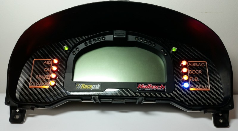 A Custom Cluster with a Racepak IQ3 Display built for a Nissan S15 Sivia 200sx with Amber LED illumination Front