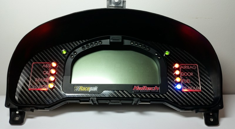 A Custom Cluster with a Racepak IQ3 Display built for a Nissan S15 Sivia 200sx with Red LED illumination Front