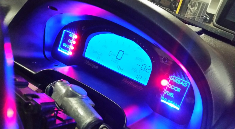 A Custom Cluster with a Racepak IQ3 Display installed in a Nissan S15 Sivia 200sx with Blue LED illumination