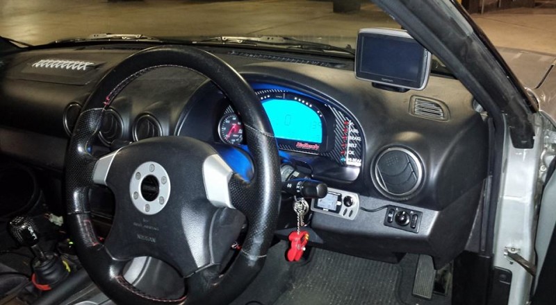 A racepak IQ3 Display installed in a Nissan Silvia S15 200SX
